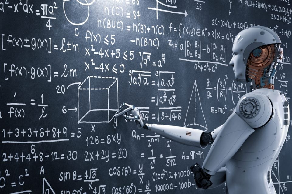 Humanoid robot looking at mathematical blackboard