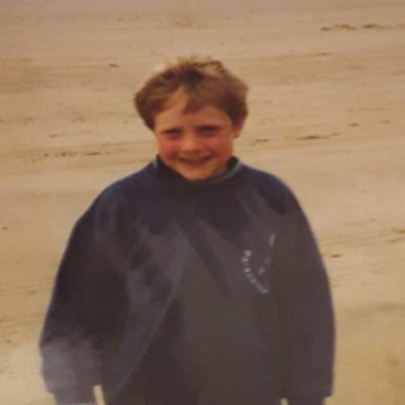 Nick Braithwaite at a boy on the beach