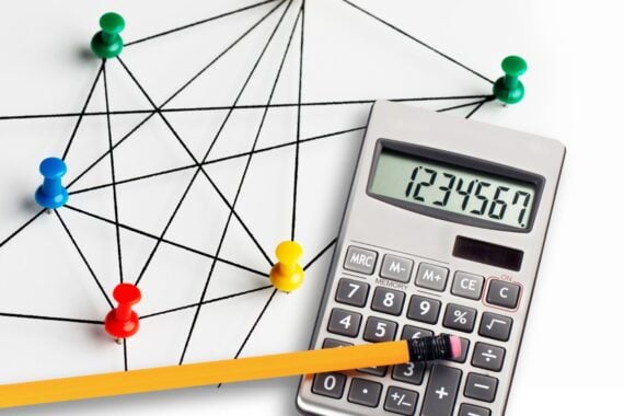 a calculator with a link of pins representing members of a membership site