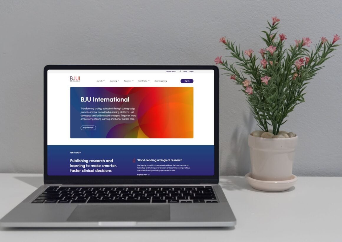 BJUI home page displayed on a laptop on a desk