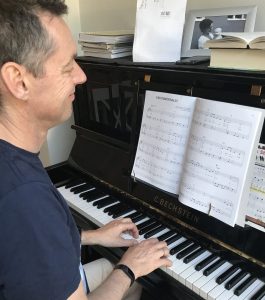John learning the piano